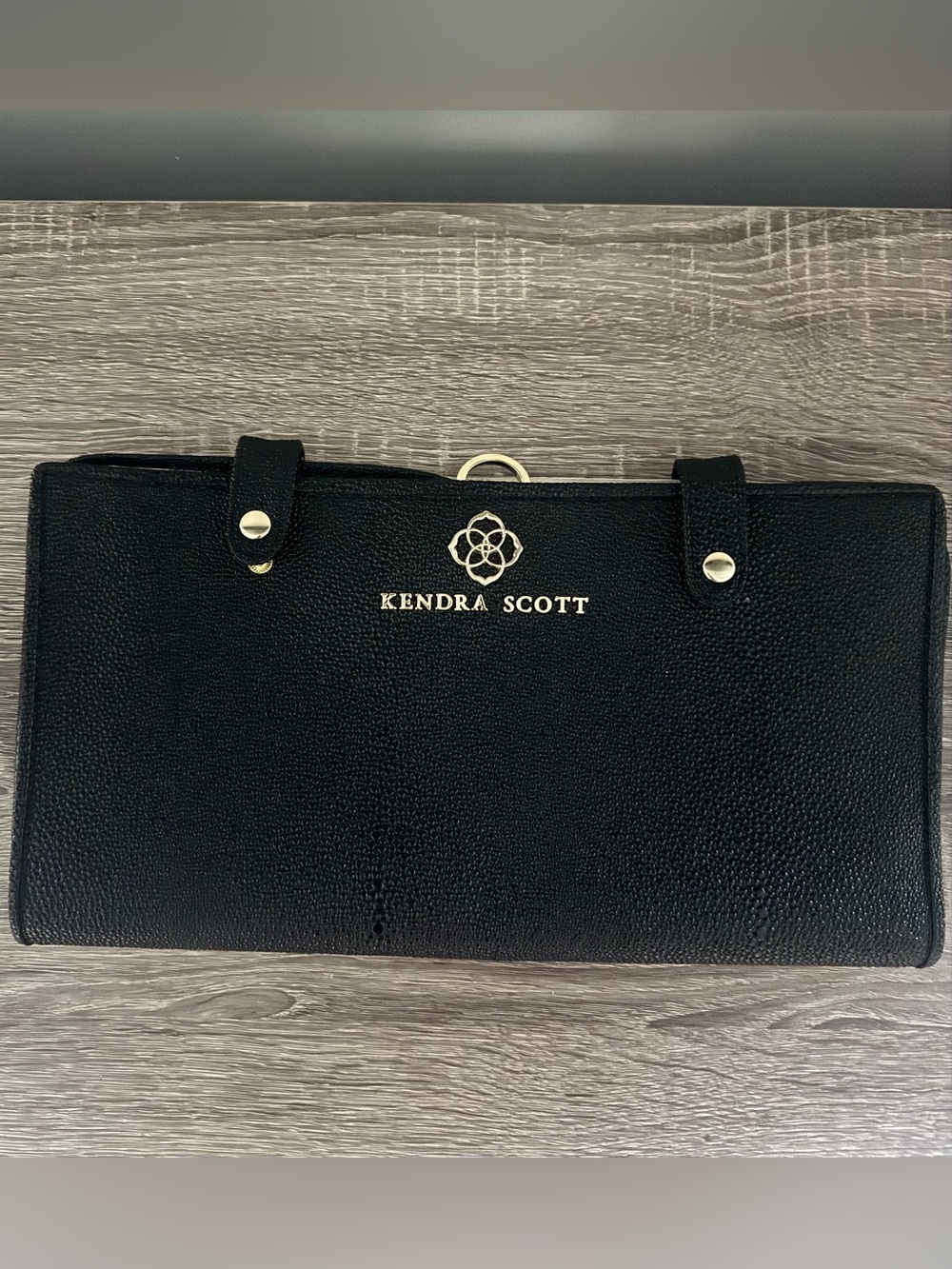 Kendra Scott Black Travel portfolio with Gold Logo